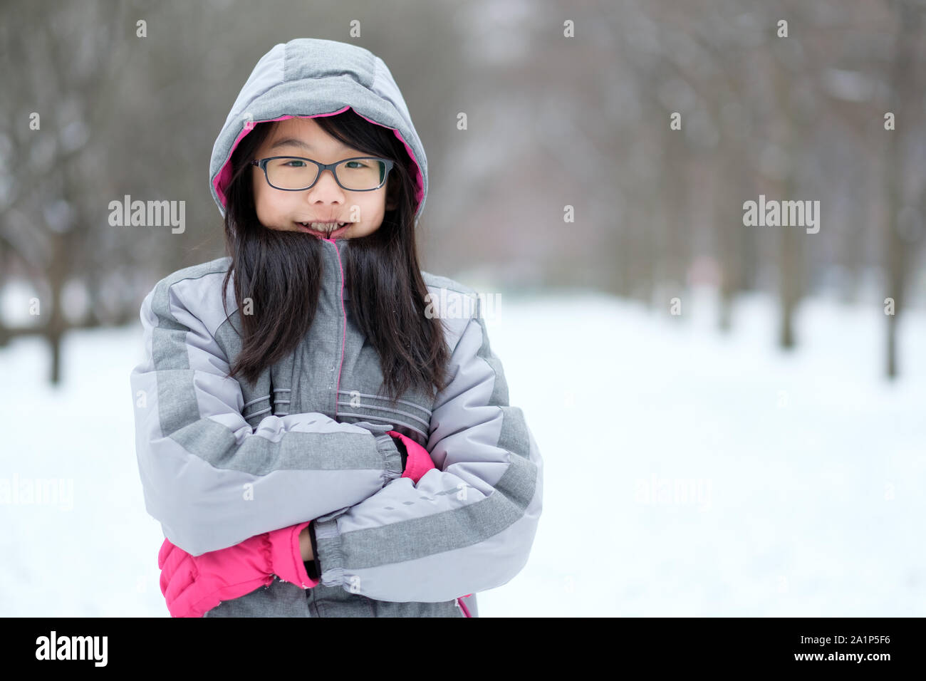 Adorable little girl wearing warm clothes outdoors on beautiful winter  snowy day Stock Photo - Alamy