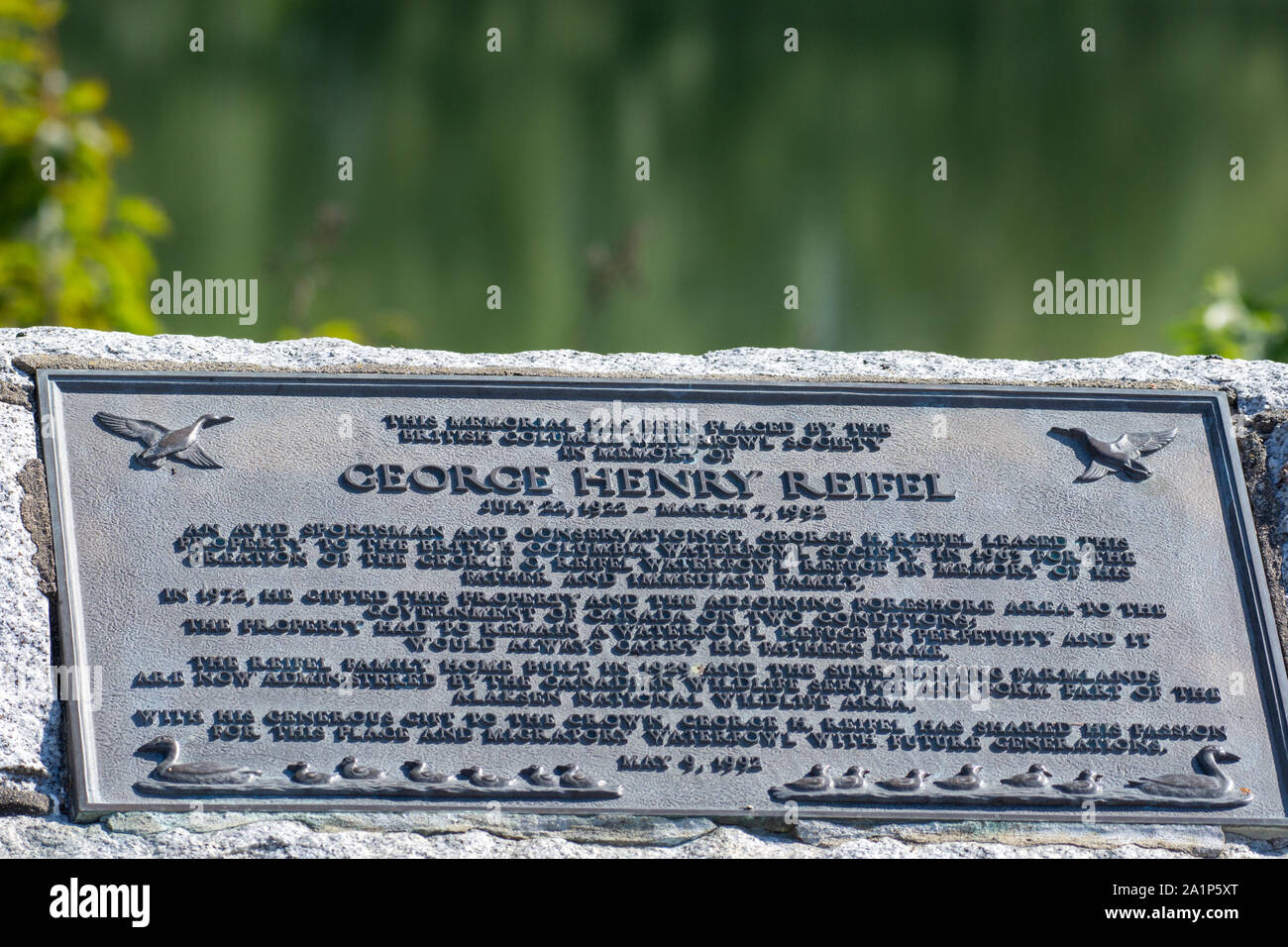 'Ladner, British Columbia/Canada - 7/25/2019: George Henry Reifel plaque in remembrance of donated land for birding santuary in Canada.' in remembranc Stock Photo