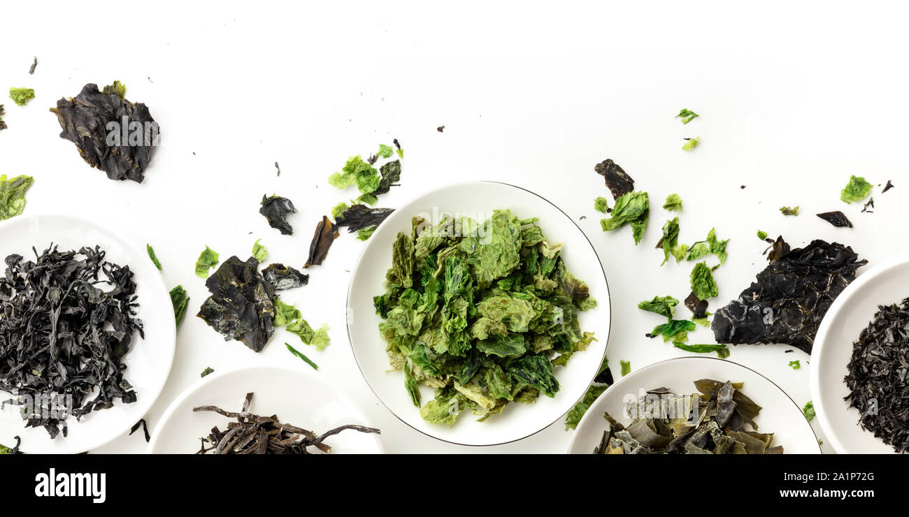 A panorama of dry seaweed, sea vegetables, shot from the top on a white background with a place for text and logo Stock Photo