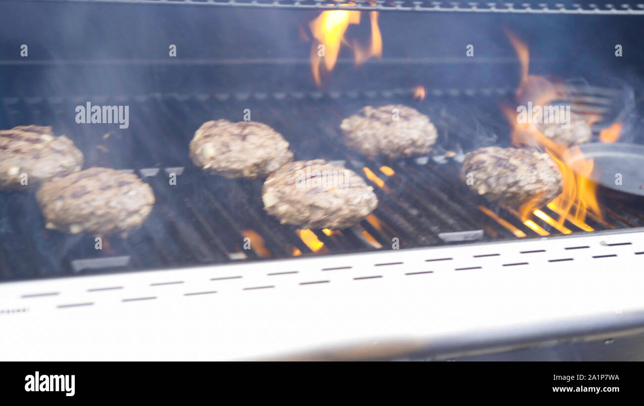 Cooking hamburger beef patties on a gas grill Stock Photo Alamy