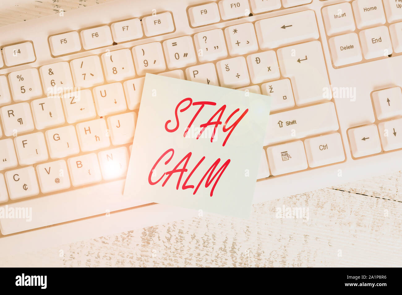 Conceptual hand writing showing Stay Calm. Concept meaning Maintain in a state of motion smoothly even under pressure Keyboard office supplies rectang Stock Photo