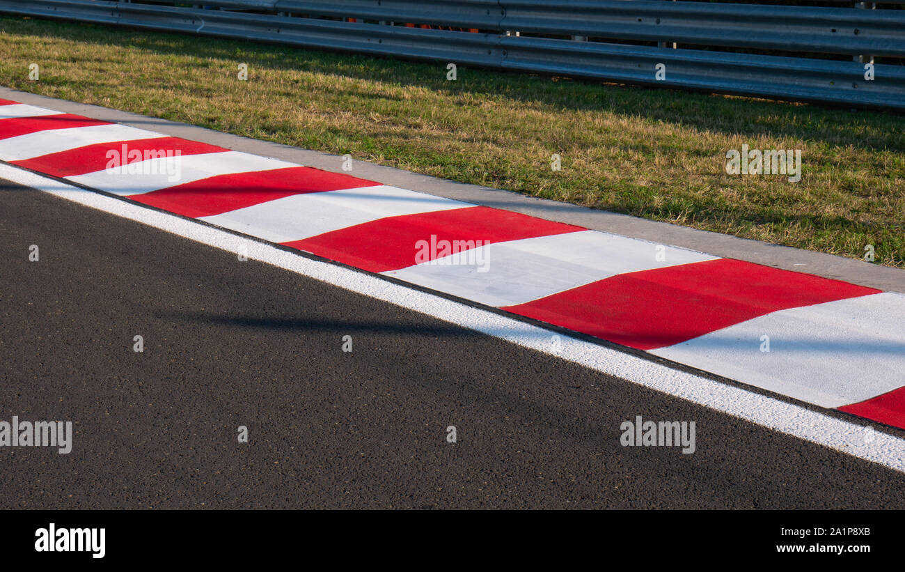 Motor racing circuit Red and White Kerb Stock Photo