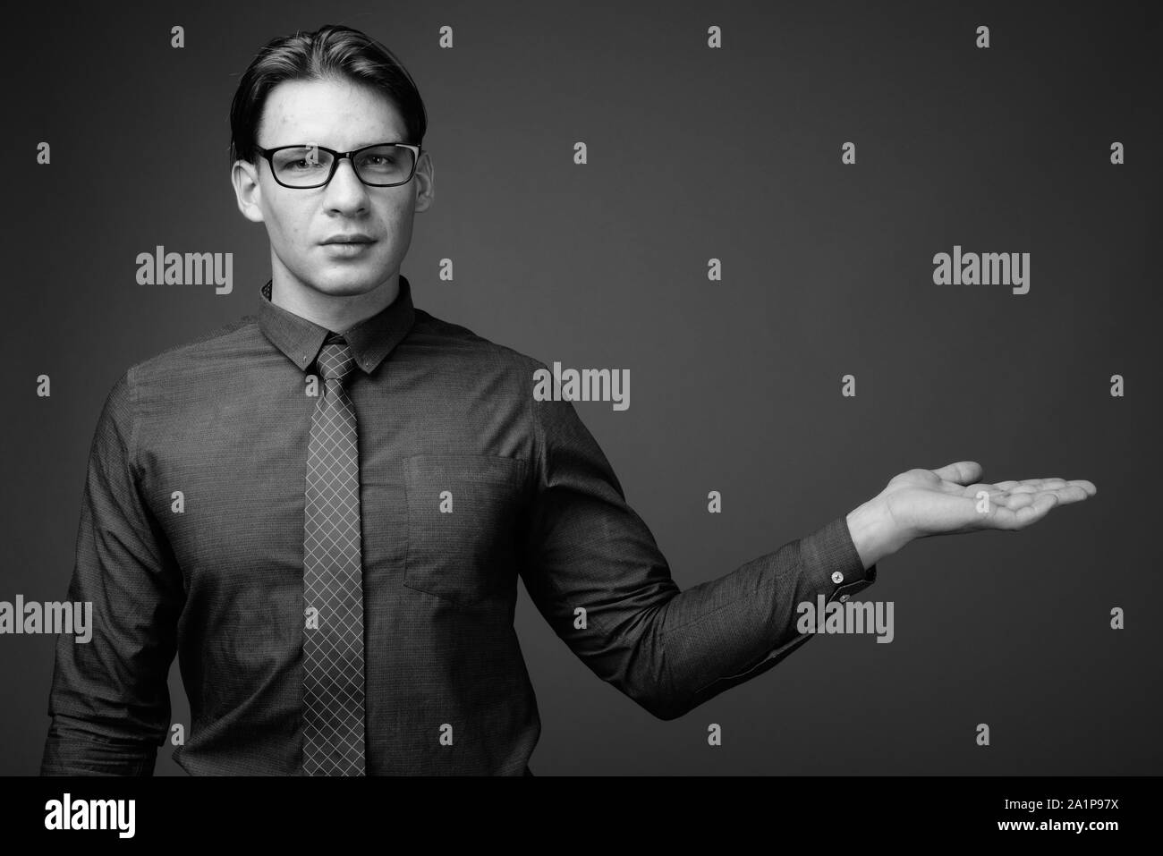 Businessman holding in hand Black and White Stock Photos & Images - Alamy