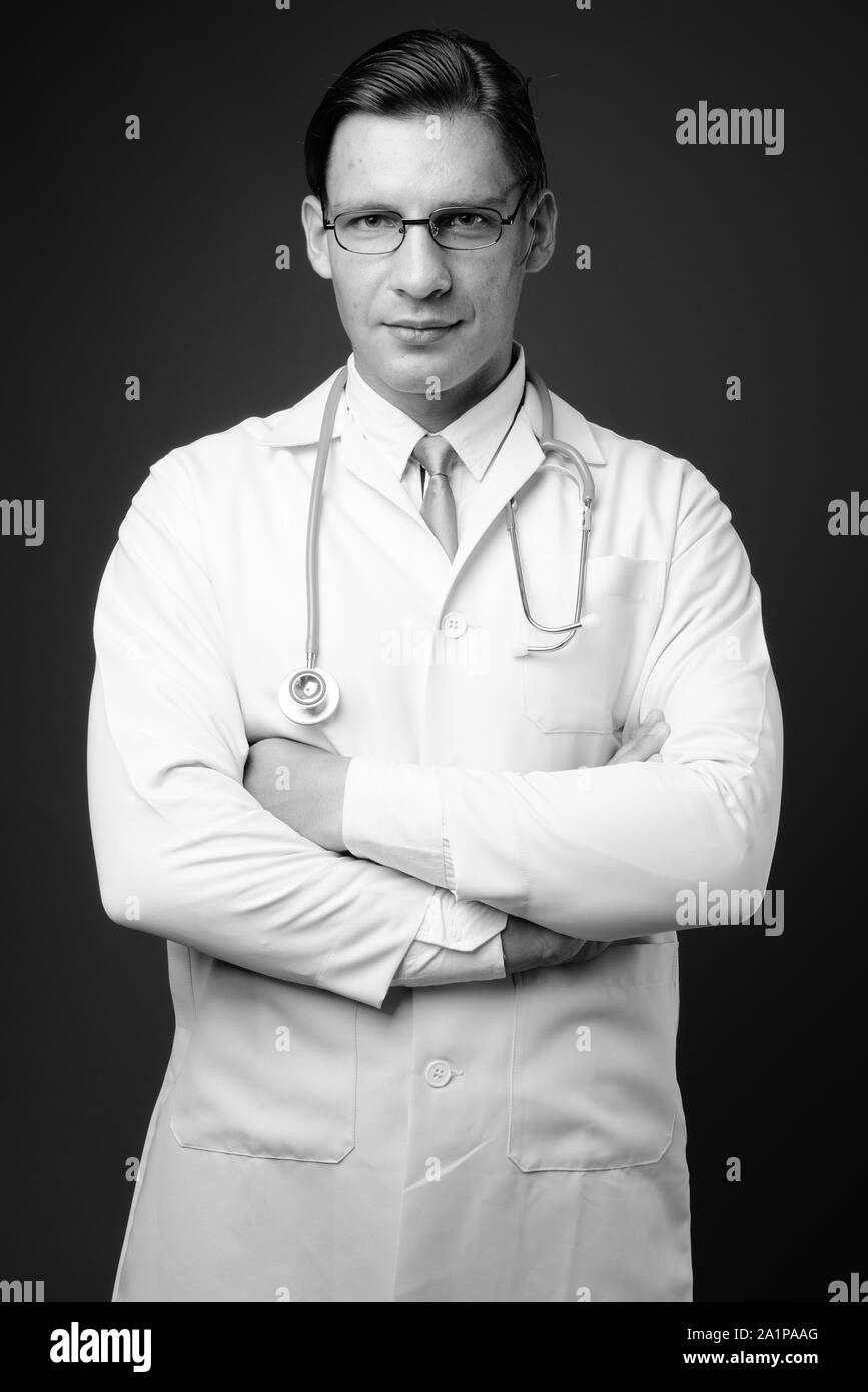 Portrait fit man crossed arms Black and White Stock Photos & Images - Alamy