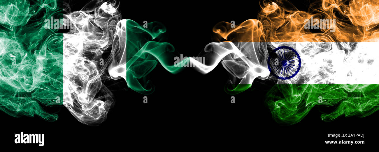 Nigeria vs India, Indian abstract smoky mystic flags placed side by side. Thick colored silky smoke flags of Nigerian and India, Indian Stock Photo