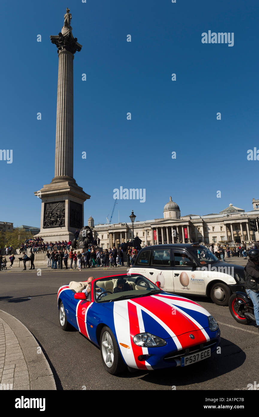 A Union Jack painted Jaguar car, Trafalgar Square, London, Britain Stock Photo
