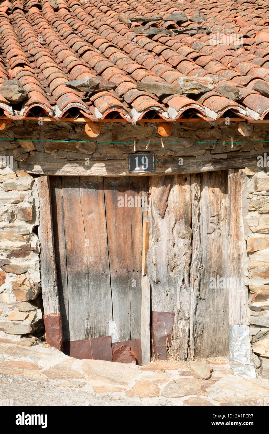 Old wooden door. Puebla de la Sierra, Madrid province, Spain. Stock Photo