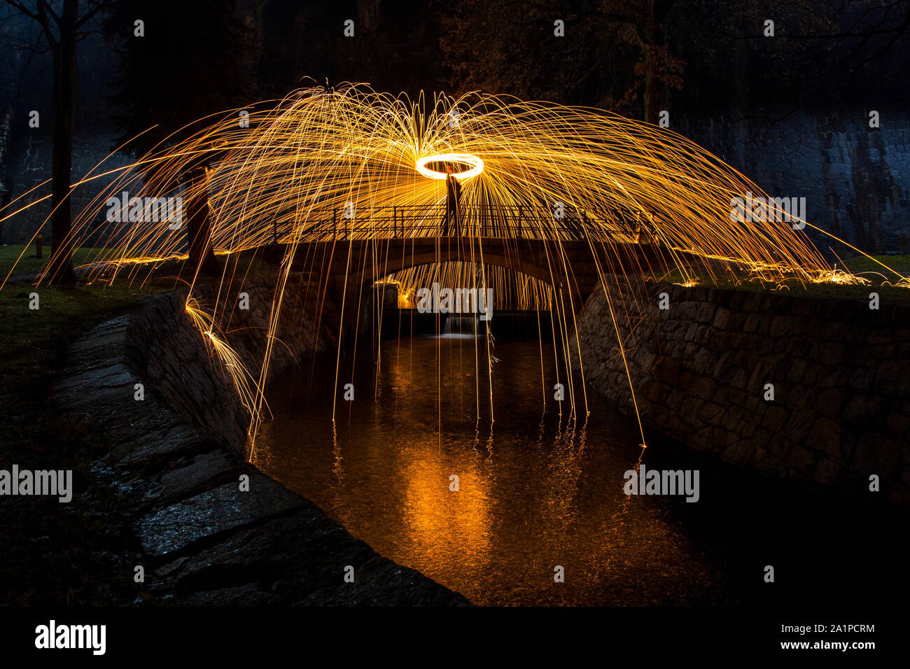 Steel wool art on a bridge of reservoir Stock Photo Alamy