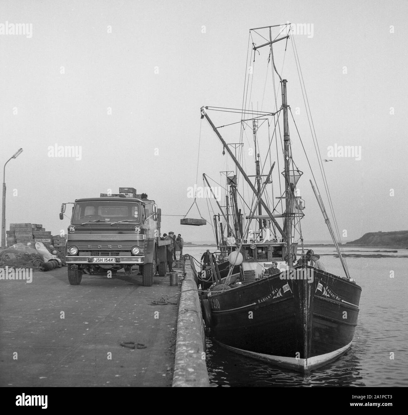 Radiant Way, BK 210,  unloading fish at  Seahouses, Northumberland, c.1972 Stock Photo