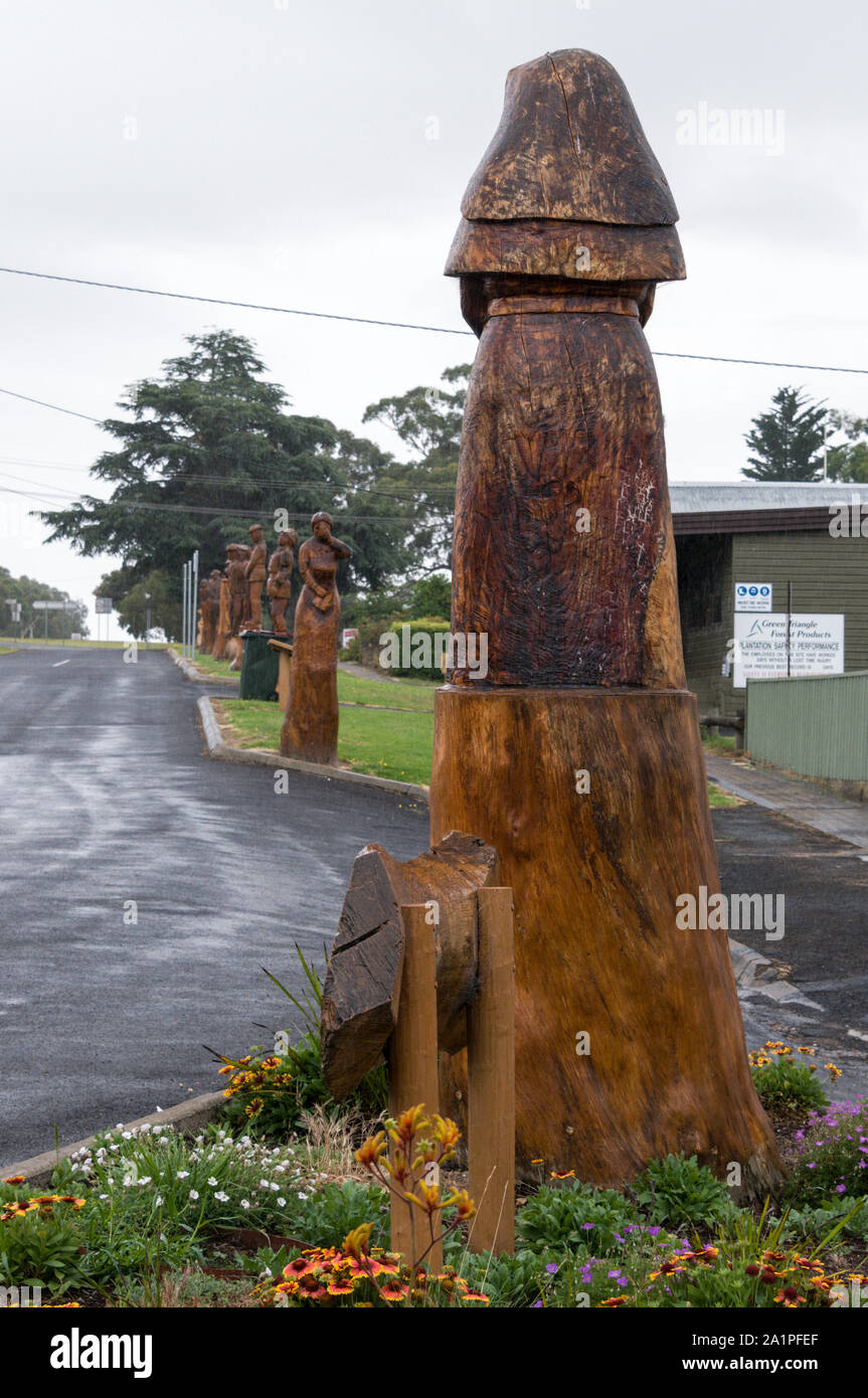 A row of tree wood carvings on the Avenue of Honour in the rural town