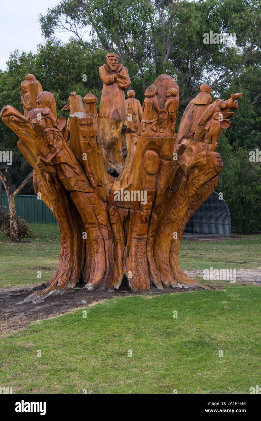 A row of tree wood carvings on the Avenue of Honour in the rural town