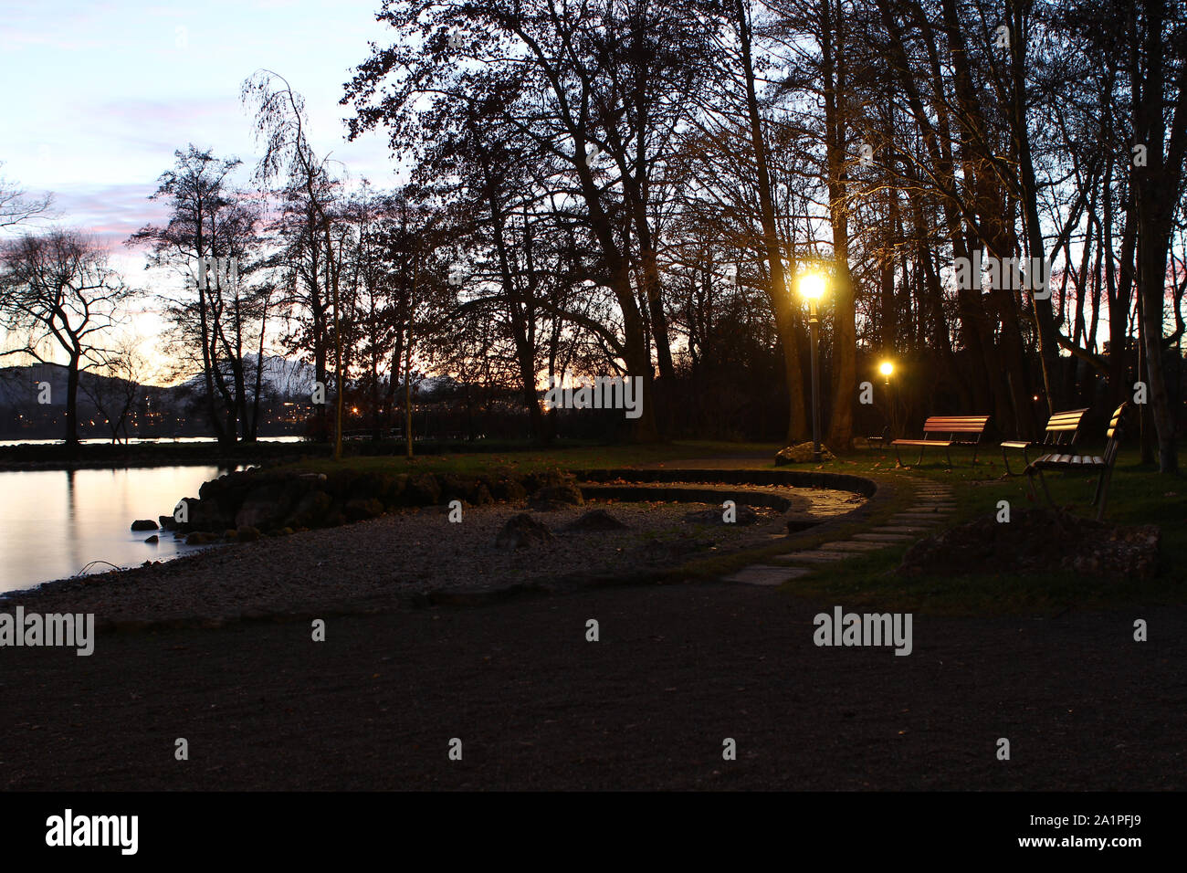 twilight by the lake in Cham, Zug with the swiss alps Stock Photo