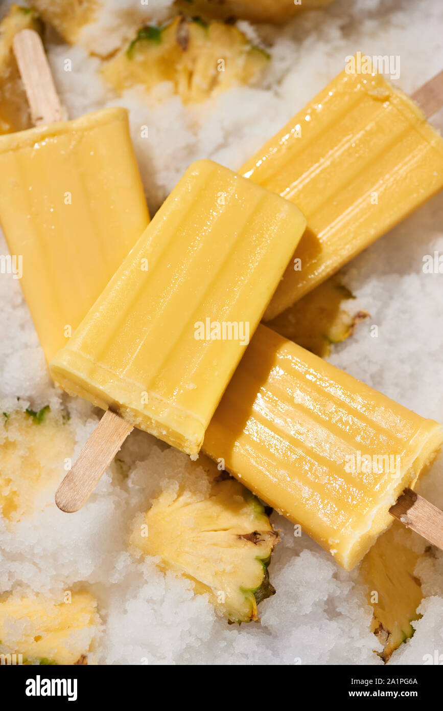 Fruit pineapple popsicle / ice cream stick focused Stock Photo Alamy