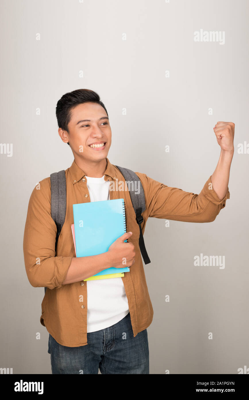 Yeah! Happy student celebrating successful ending of exams Stock Photo