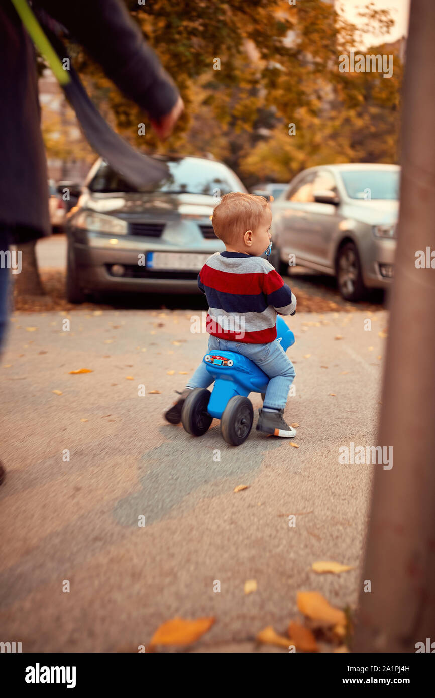 little boy on bike. Family, childhood, season and people concept. Stock Photo
