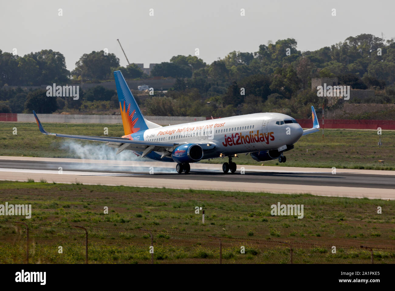 Jet2 Holidays Boeing 737-8K5 (Reg: G-JZHA) thrust reversing after touch down. Stock Photo