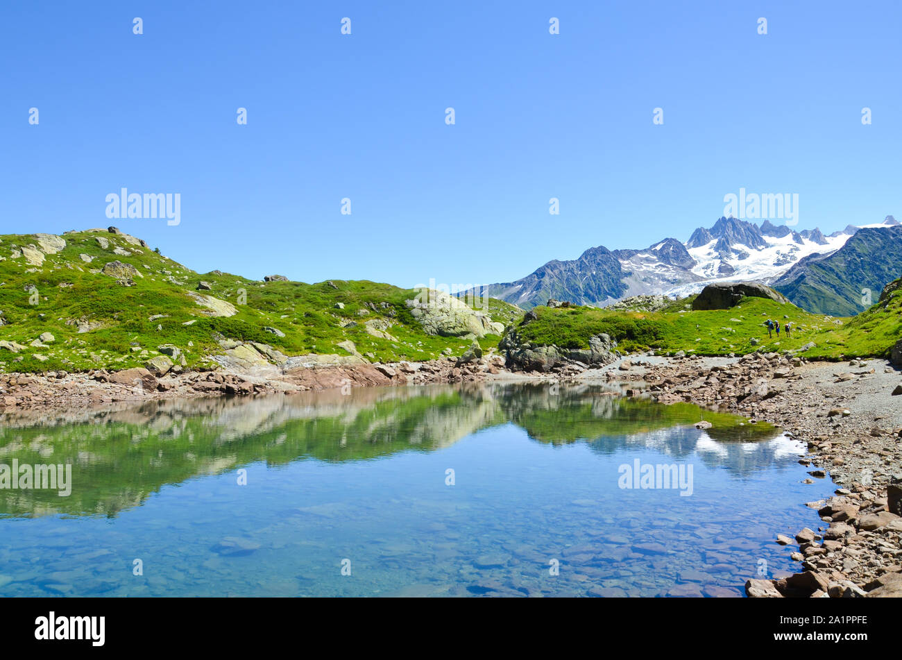 Beautiful Lac de Cheserys, Lake Cheserys near Chamonix-Mont-Blanc in French Alps. Alpine lake with snow capped mountains in background. France mountain, Tour du Mont Blanc. Amazing landscapes. Stock Photo