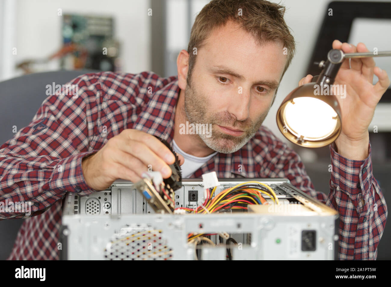 Technician fixing chip on motherboard hi-res stock photography and ...