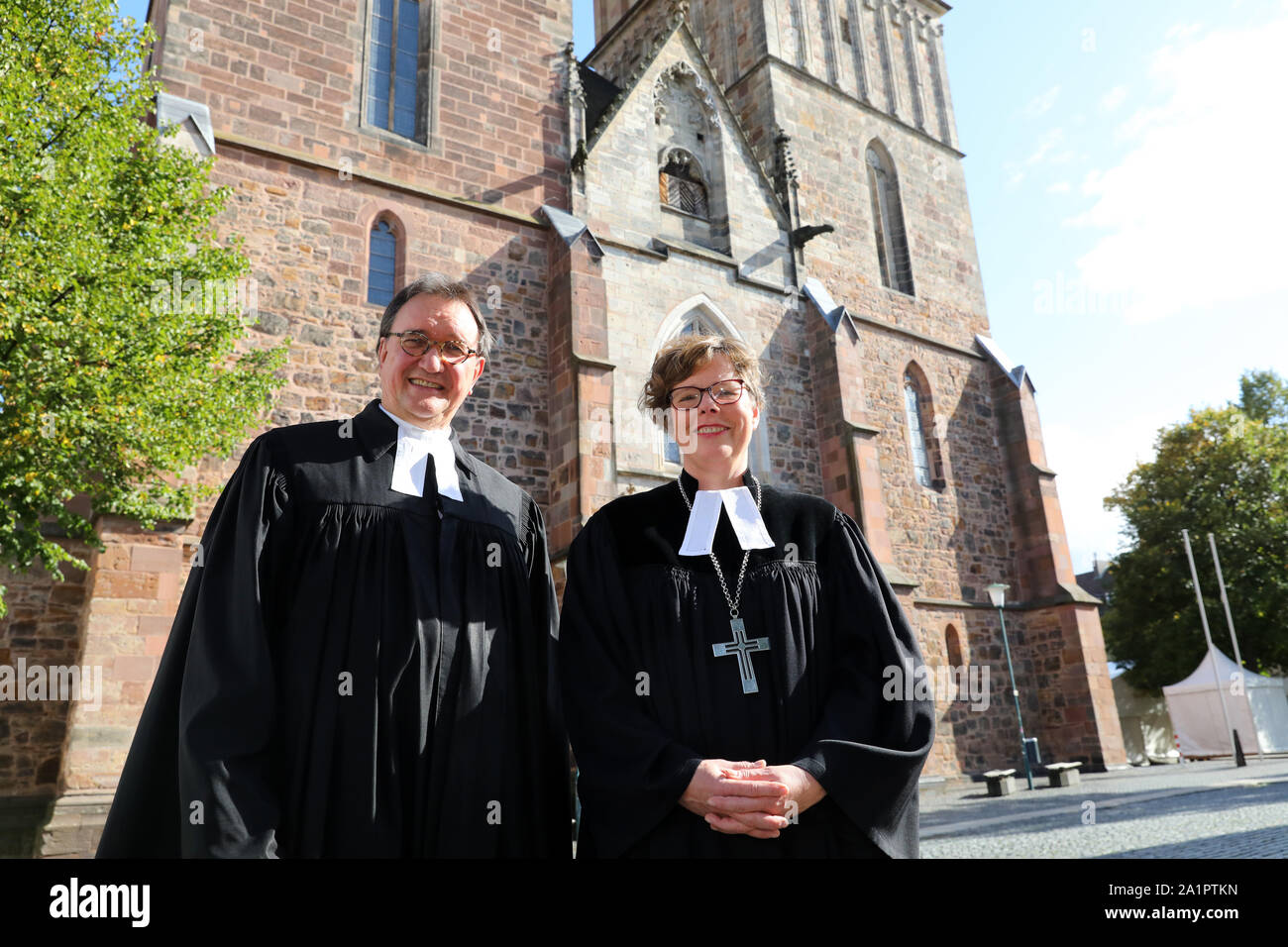Kassel, Germany. 11th Oct, 2015. Bishop Beate Hofmann (r) and her  predecessor Martin Hein stand in front of the Martinskirche. The  Evangelical Church of Kurhessen-Waldeck gets a bishop for the first time
