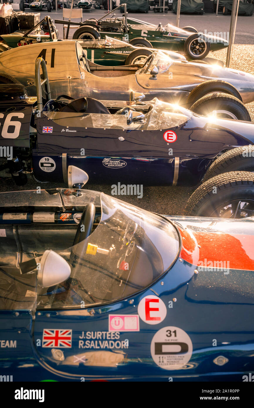 Collection of single-seater, open-wheel racers that competed during the late 50's and early 60's. Early morning light. 2019 Goodwood.Revival paddock. Stock Photo