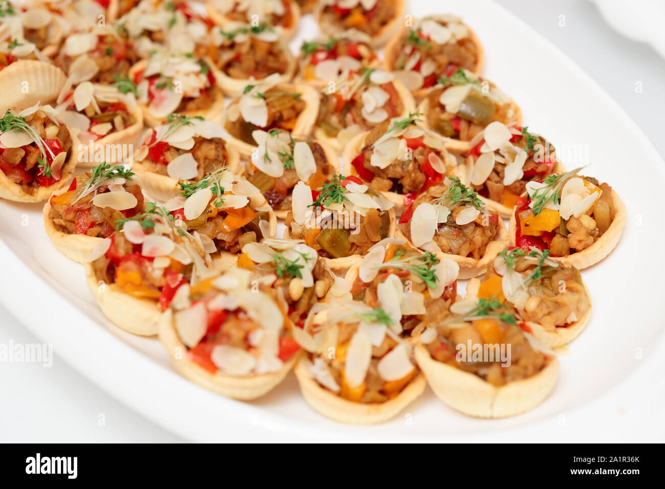 Vegetable appetizer with almond slices on plate, close-up Stock Photo