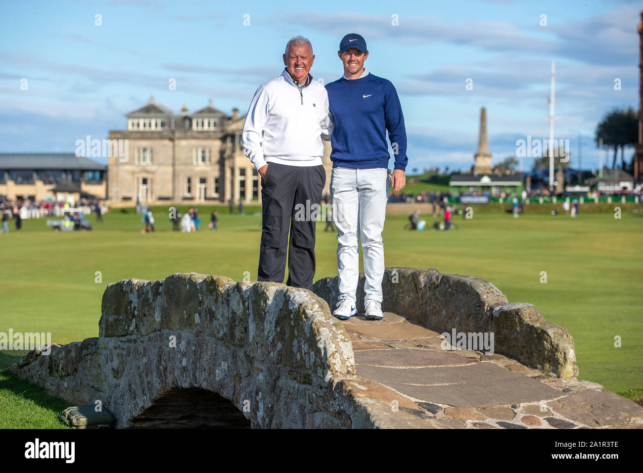 Rory McIlroy poses with his father Gerry on the Swilken bridge during