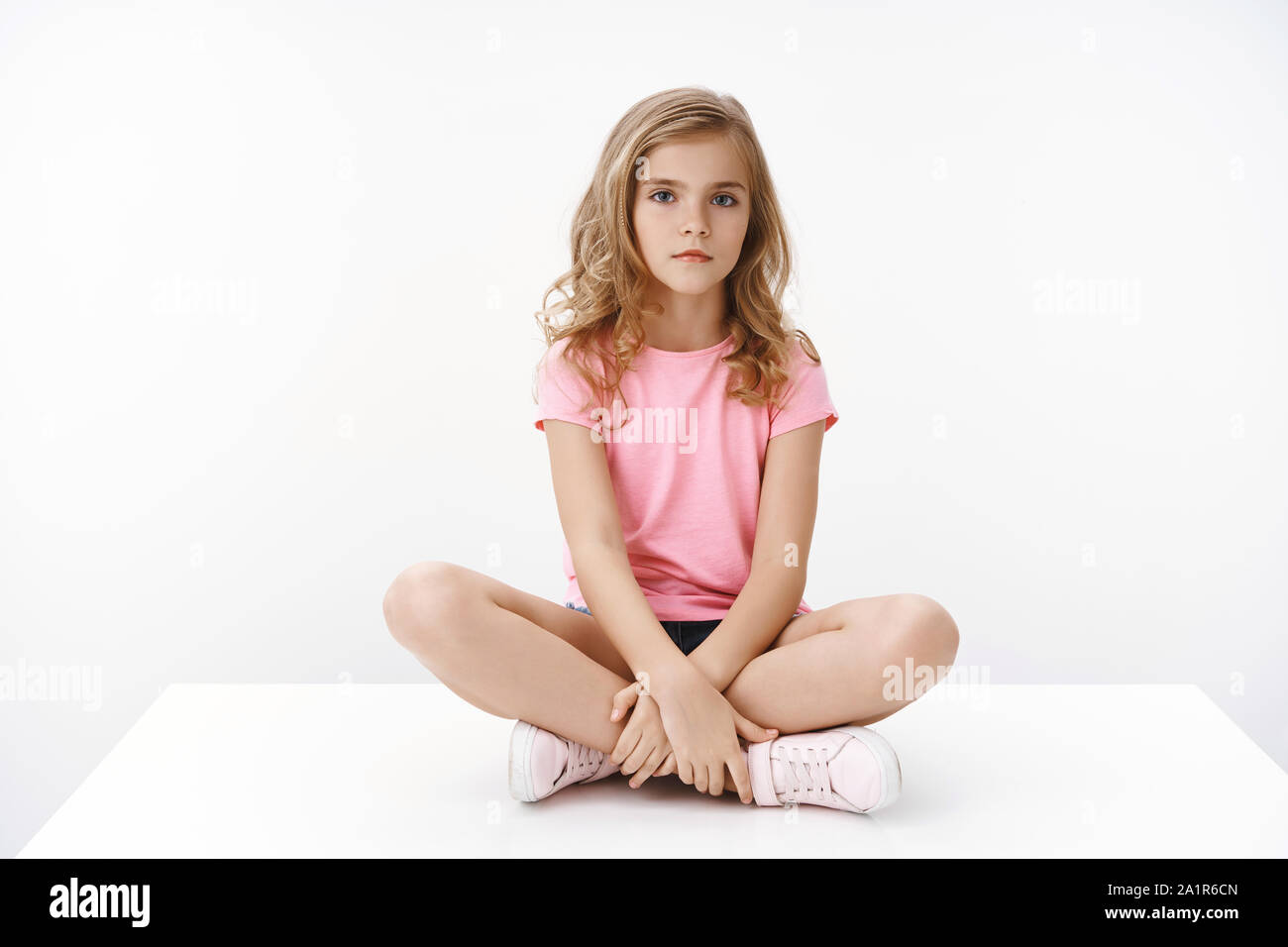 Beautiful little girl sitting legs hires stock photography and images