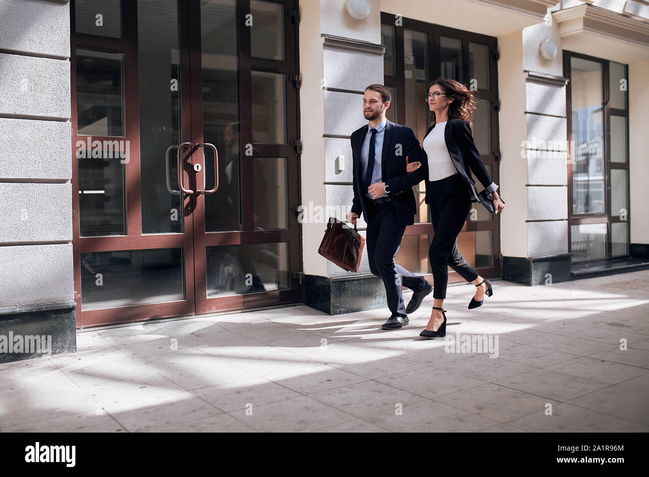 young active ambitious motivated people rushing to work, full length ...