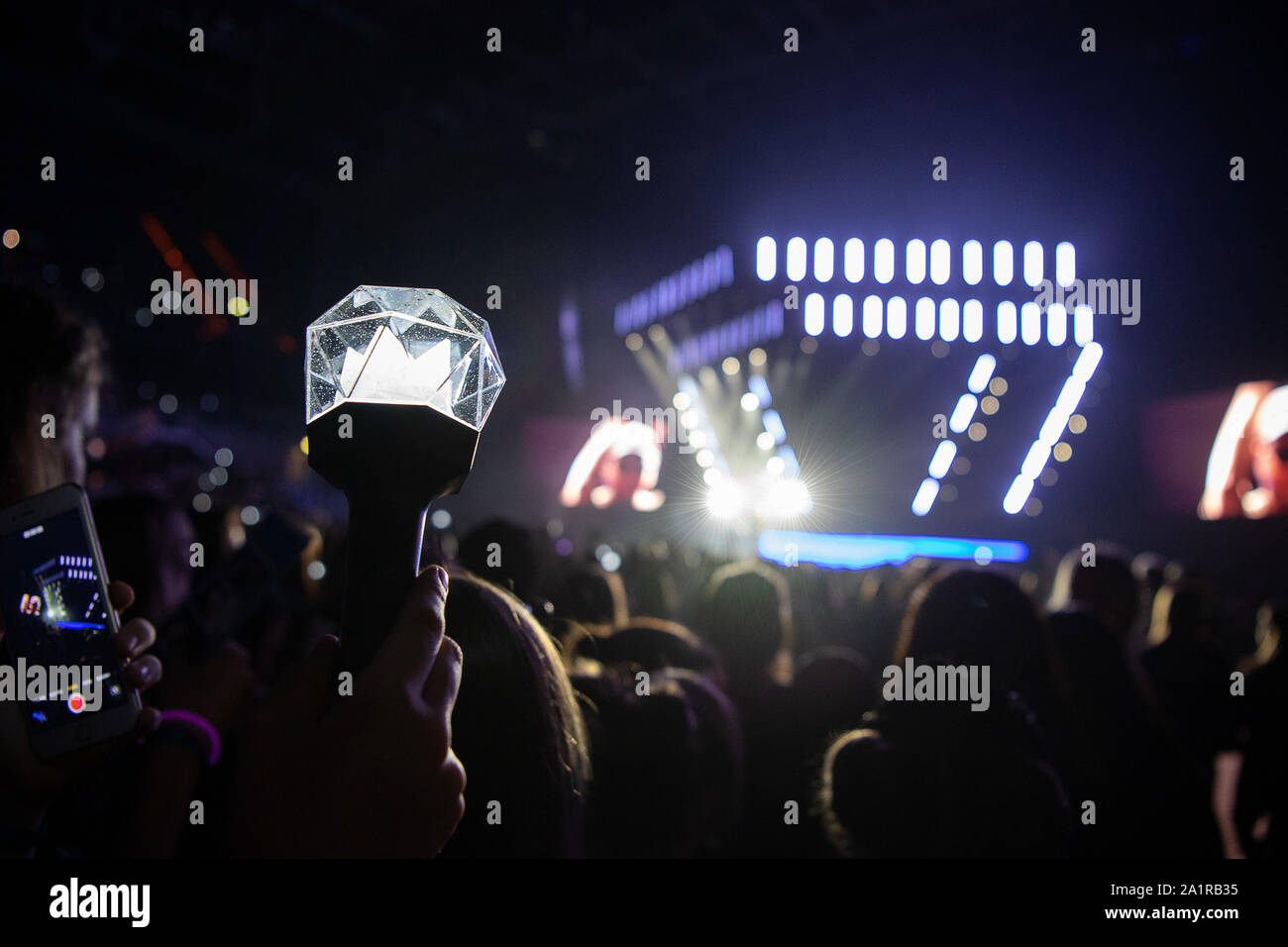 Mannheim, Germany. 28th Sep, 2019. A fan holds a lightstick in his hand  during the K-Pop-Festival "Finger Heart Festival". Korean-language pop  music is also celebrating success outside Asia. Girl and boy bands