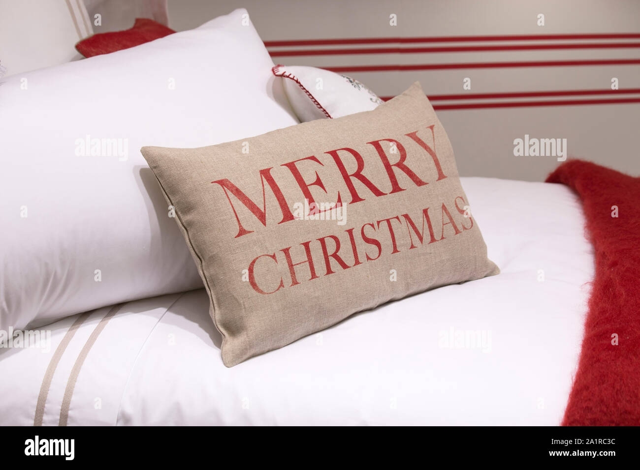 Christmas pillows on a bed Stock Photo Alamy