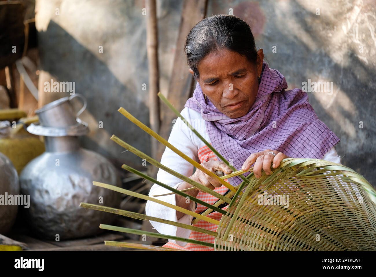 Woman is weaving basket of bamboo. Village Khrang, KhasiHills, state