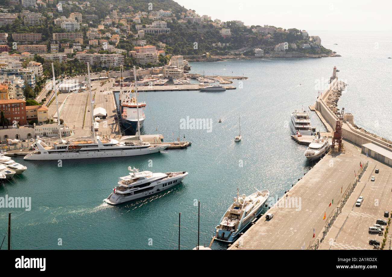 Superyacht ROE leaving Nice harbour with charter yacht Le Ponant moored behind, Nice, France, Europe Stock Photo