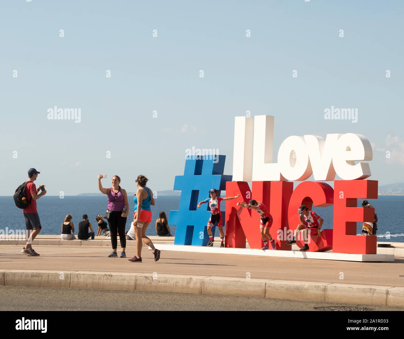 Young people taking photos at the I Love Nice sculpture in Nice, France, Europe Stock Photo