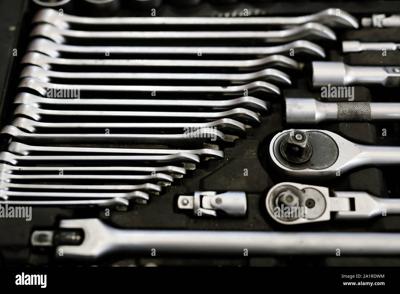 Set of steel technician instruments laid in rows inside toolbox that can be used as technical background Stock Photo