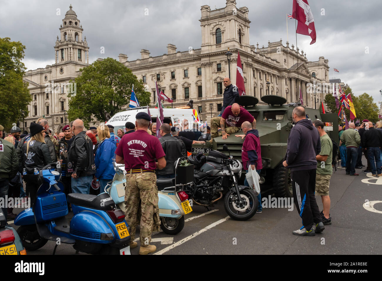 London, UK. 28th Sep, 2019. Hundreds had come to march in Operation Zulu, the protest against the prosecution of 'Soldier F' for the murder of civil rights protesters in Londonderry on 'Bloody Sunday' in 1972. Parliament Square was ringed with motor bikes as a part of the event which was called Operation Rolling Thunder. A small group stood on an armoured car to 'moon' at Parliament. Credit: Peter Marshall/Alamy Live News Stock Photo