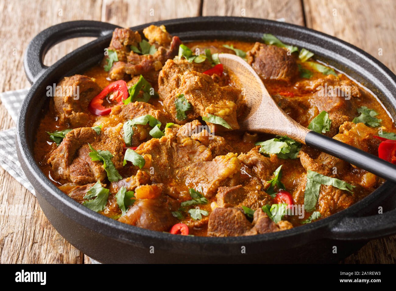 Kashmiri Lamb rogan josh with spices and gravy close-up in a pan on the table. horizontal Stock Photo