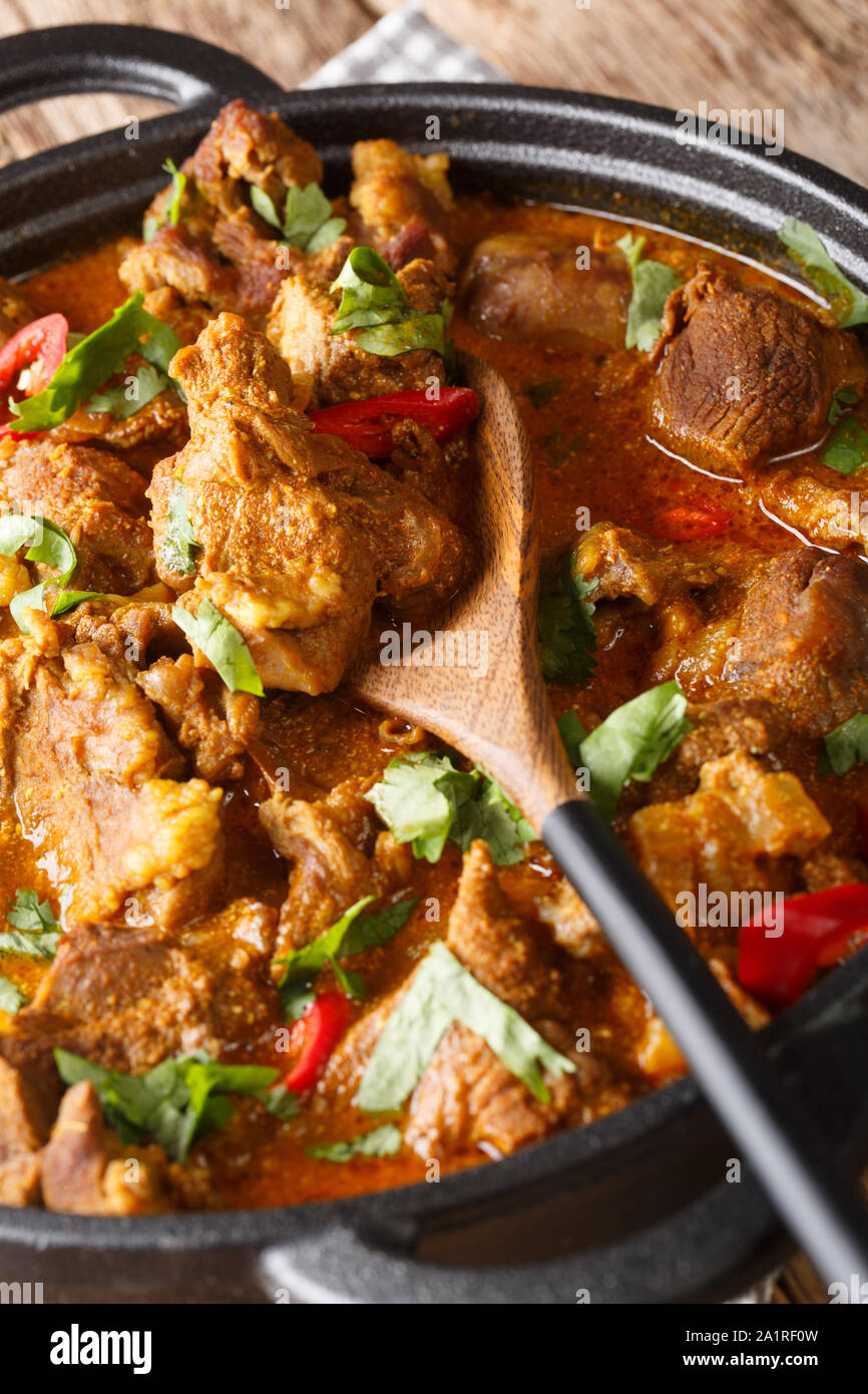Lamb rogan josh close-up in a pan on the table. vertical Stock Photo