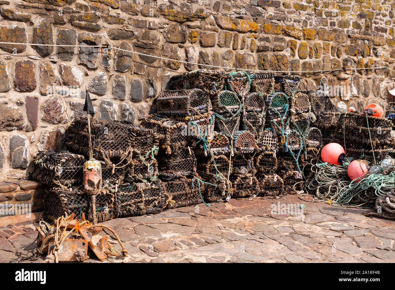 Lobster pots at Clovelly harbour on the north Devon coast Stock Photo