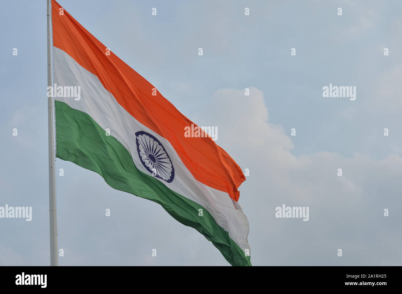 Indian National Flag, the tricolor fluttering and unfurling in the Central Park at Connaught Place, Delhi, India. Stock Photo