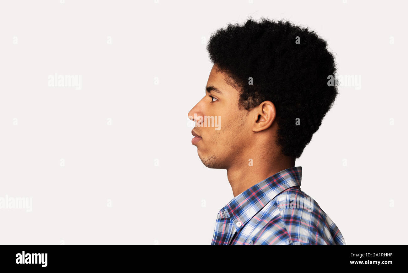 Profile Portrait Of Afro Teen Guy Over White Background Stock