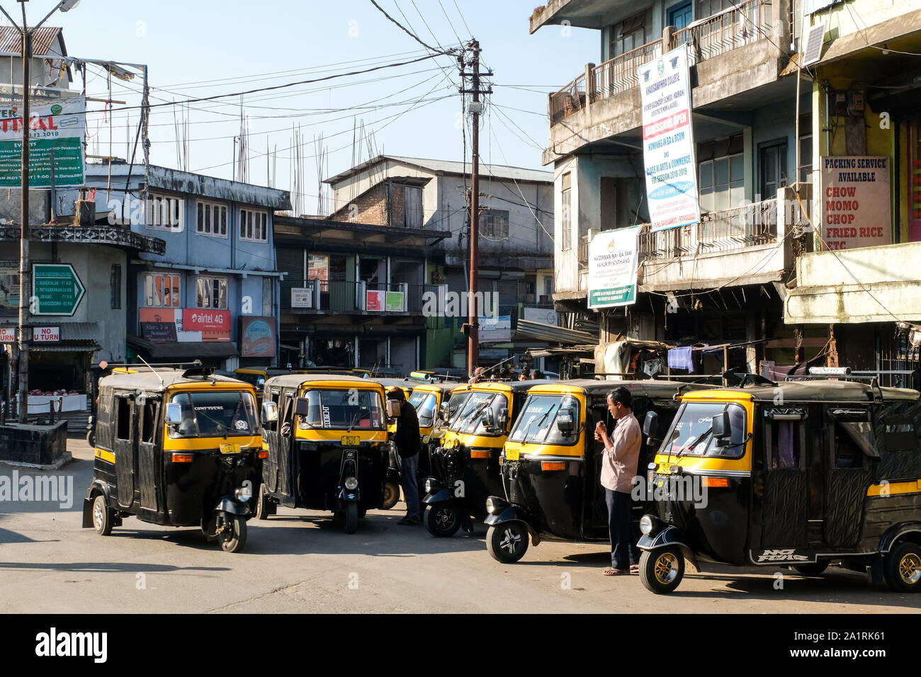 Three-wheelers wait for customers at a taxi rank in Mairang City. State of Meghalaya, Northeast India Stock Photo