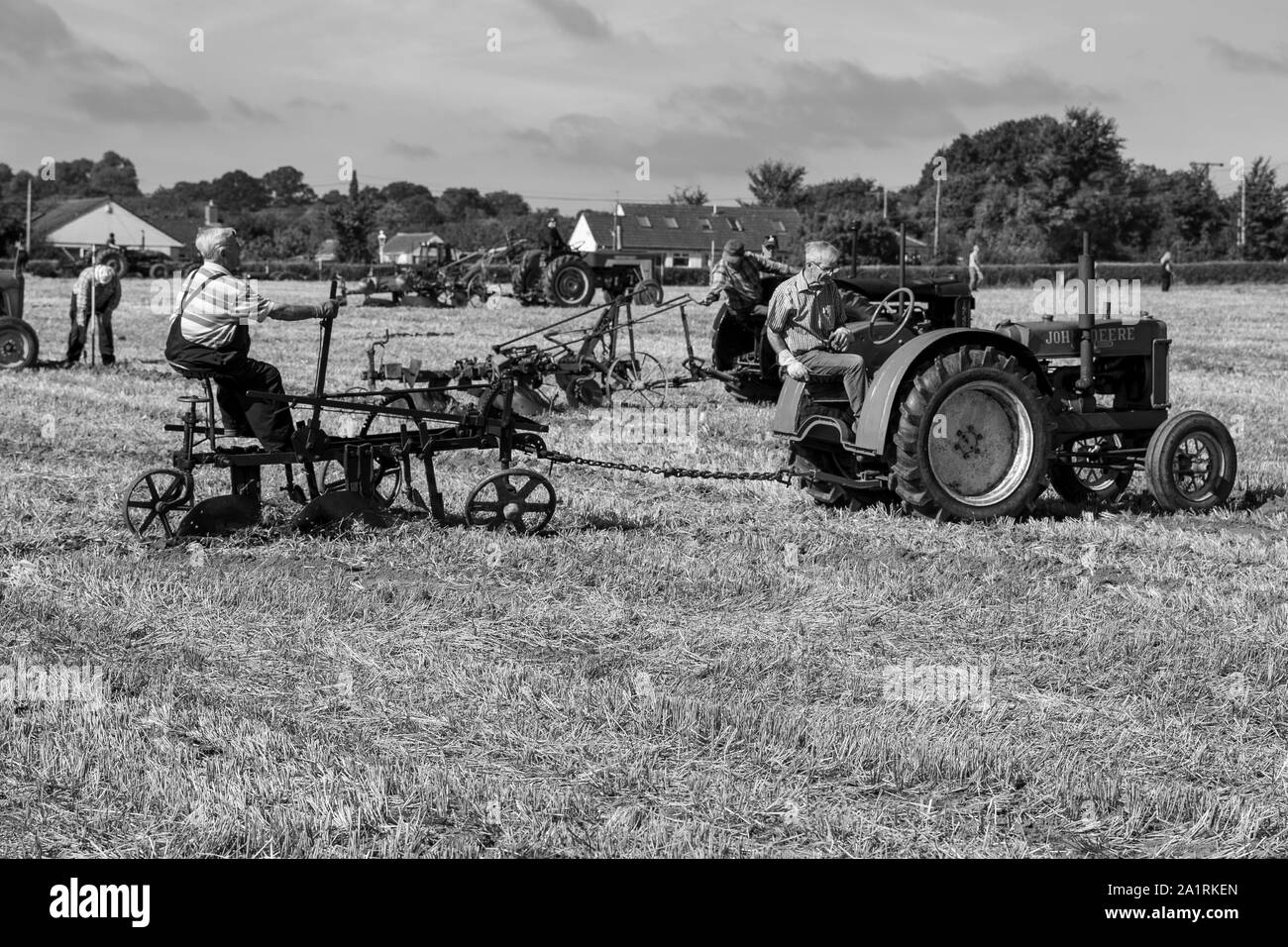 2 Farmers Ploughing using a John Deere General Purpose Vintage Tractor at the Chew Stoke Vintage Tractor and Ploughing Display 2019 Stock Photo