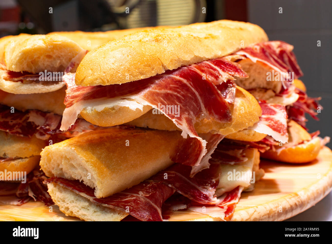 Spanish tapas street food, bocadillo fresh bread with jamon iberico ready  to eat Stock Photo - Alamy