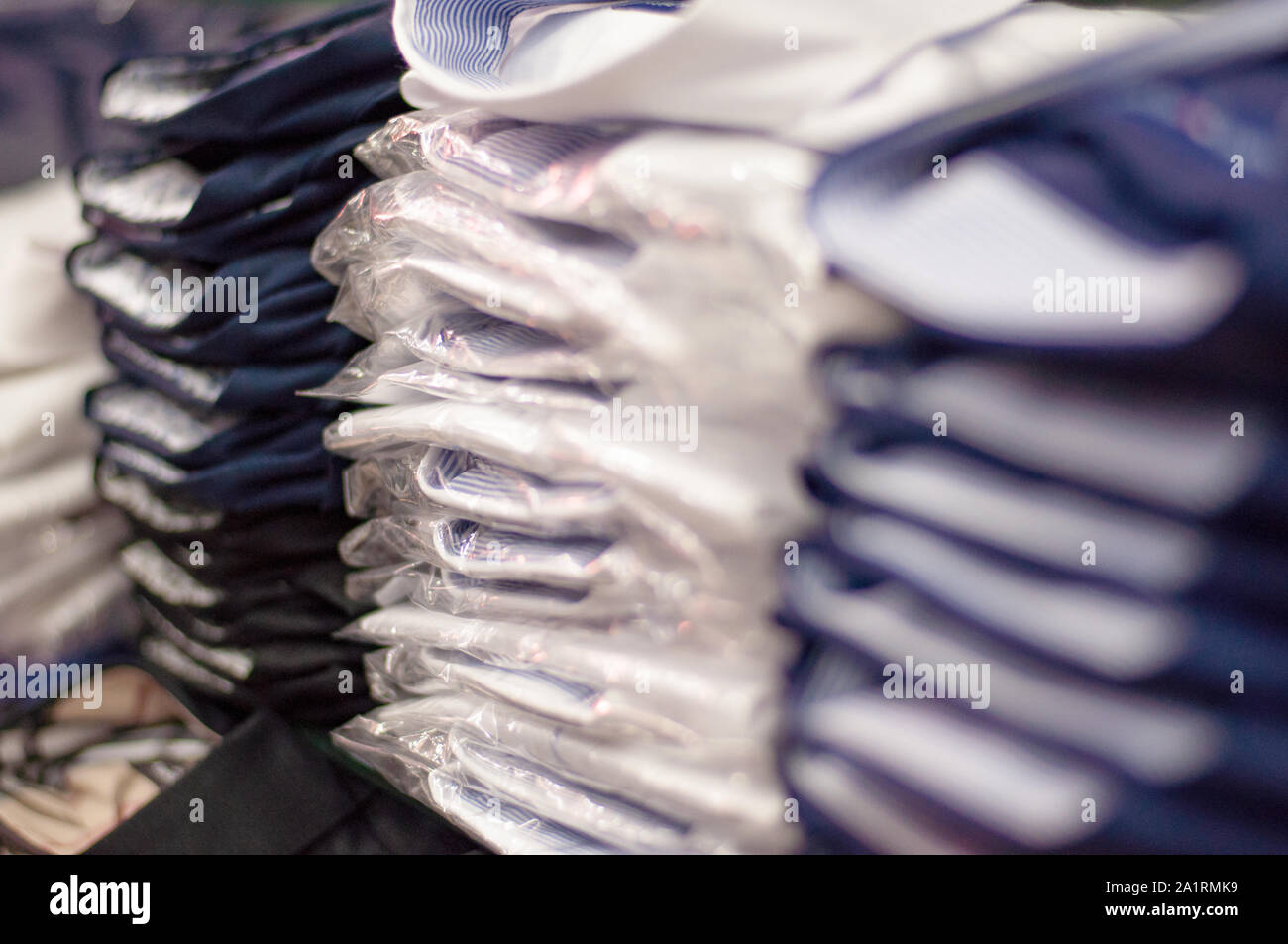 Piles of folded shirts hi-res stock photography and images - Alamy