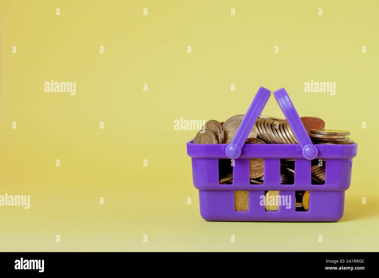 Coins in a shopping basket. Concept of finance and money. an investment