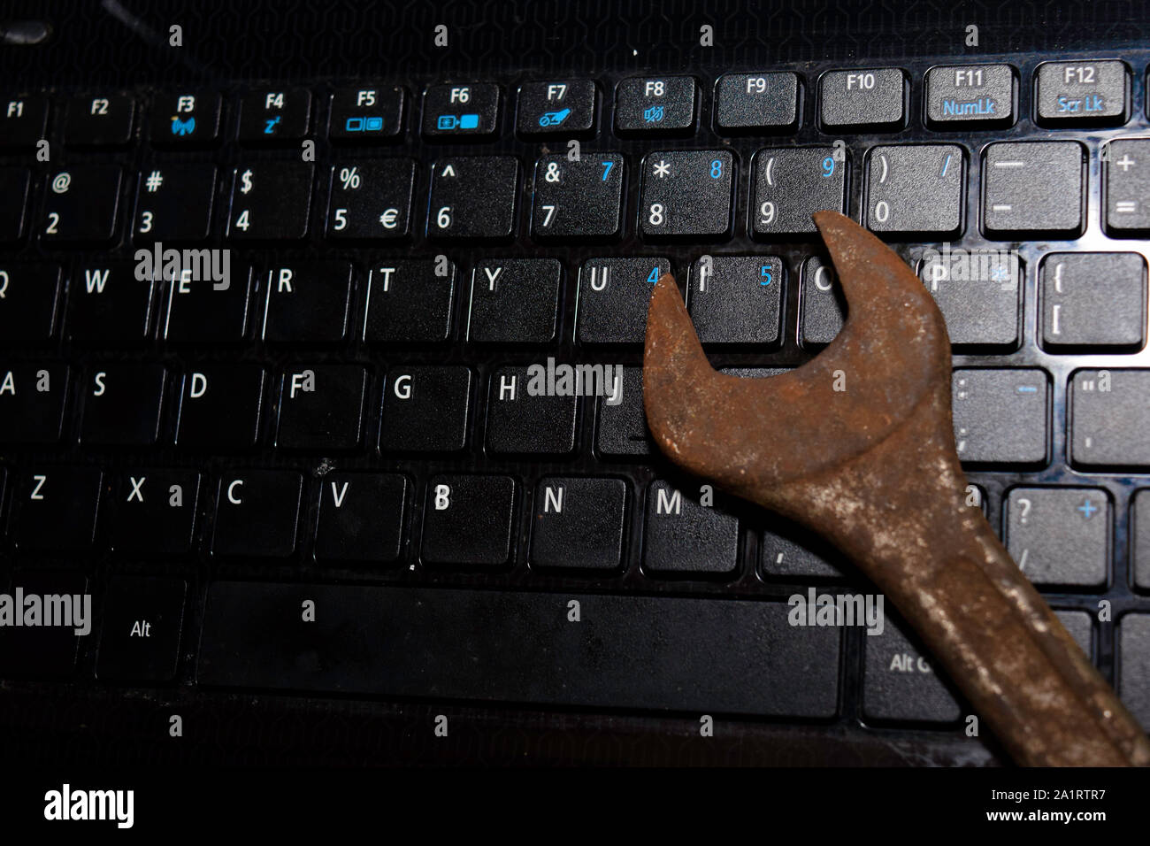 Keyboard Laptop with Wrench repair PC or laptop concept Stock Photo - Alamy