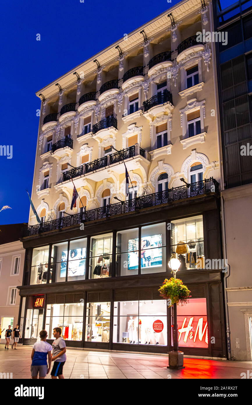 A historical building on Rijeka's Korzo shopping street, Croatia. The H&M  store has been converted to a modern front on the lower two floors with th  Stock Photo - Alamy