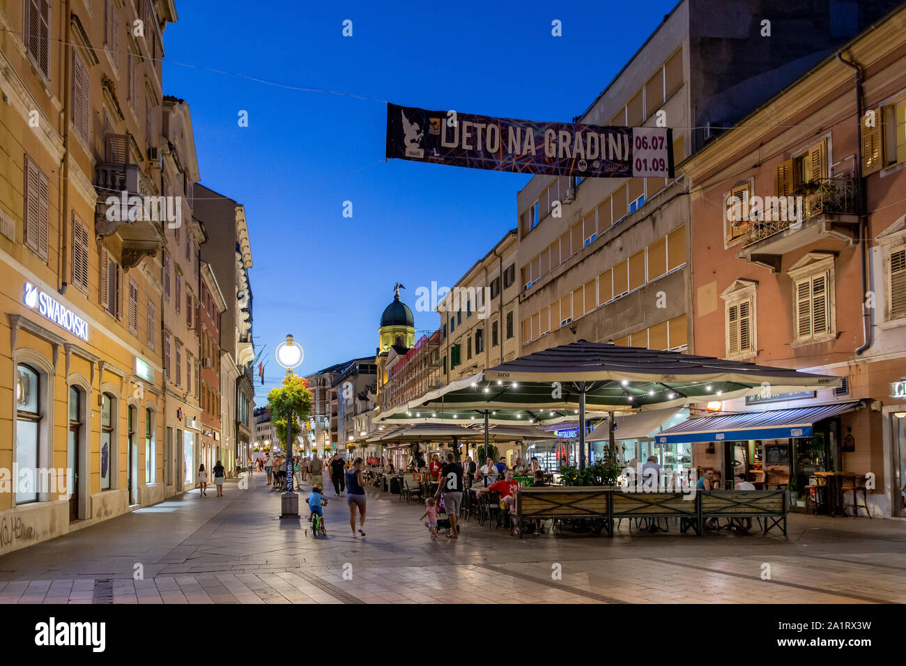 Restaurants & Cafe/Bars on The Korzo pedestrian zone in the centre of Rijeka on a summer evening. Croatia Stock Photo