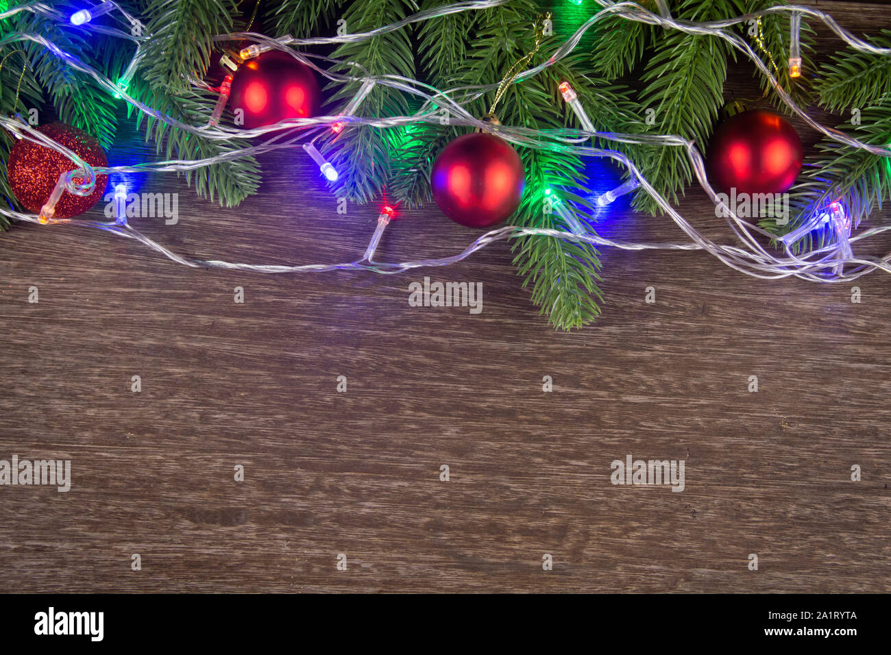 Christmas decorations with branches of fir tree and christmas lights ...