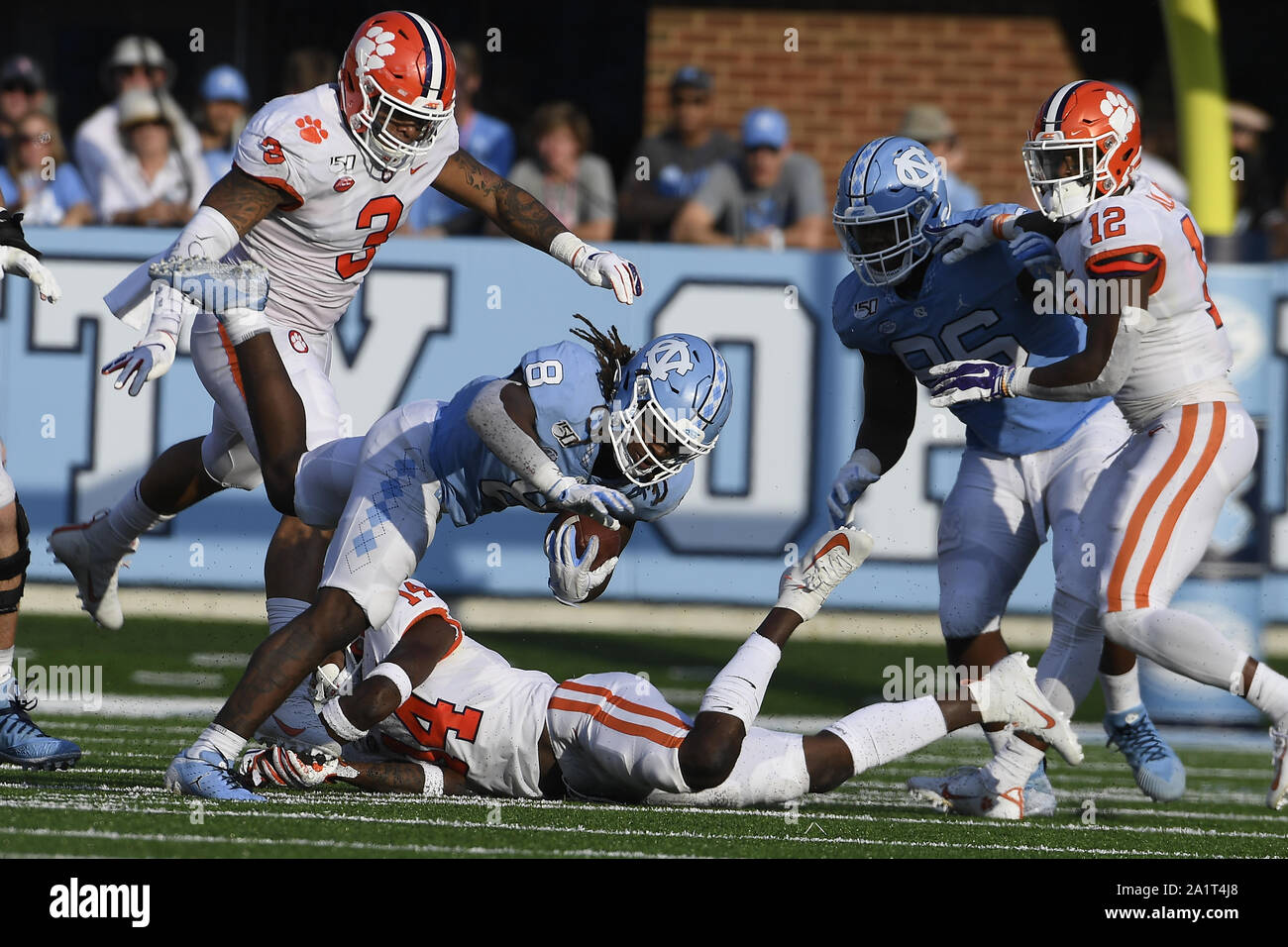 Chapel Hill, North Carolina, USA. 28th Sep, 2019. MICHAEL CARTER (8) of North Carolina carries the ball against DENZEL JOHNSON (14) of Clemson. The North Carolina Tar Heels played the Clemson Tigers in a football game that took place at the Kenan Memorial Stadium in Chapel Hill, N.C. on Saturday, September 28, 2019. Credit: Fabian Radulescu/ZUMA Wire/Alamy Live News Stock Photo
